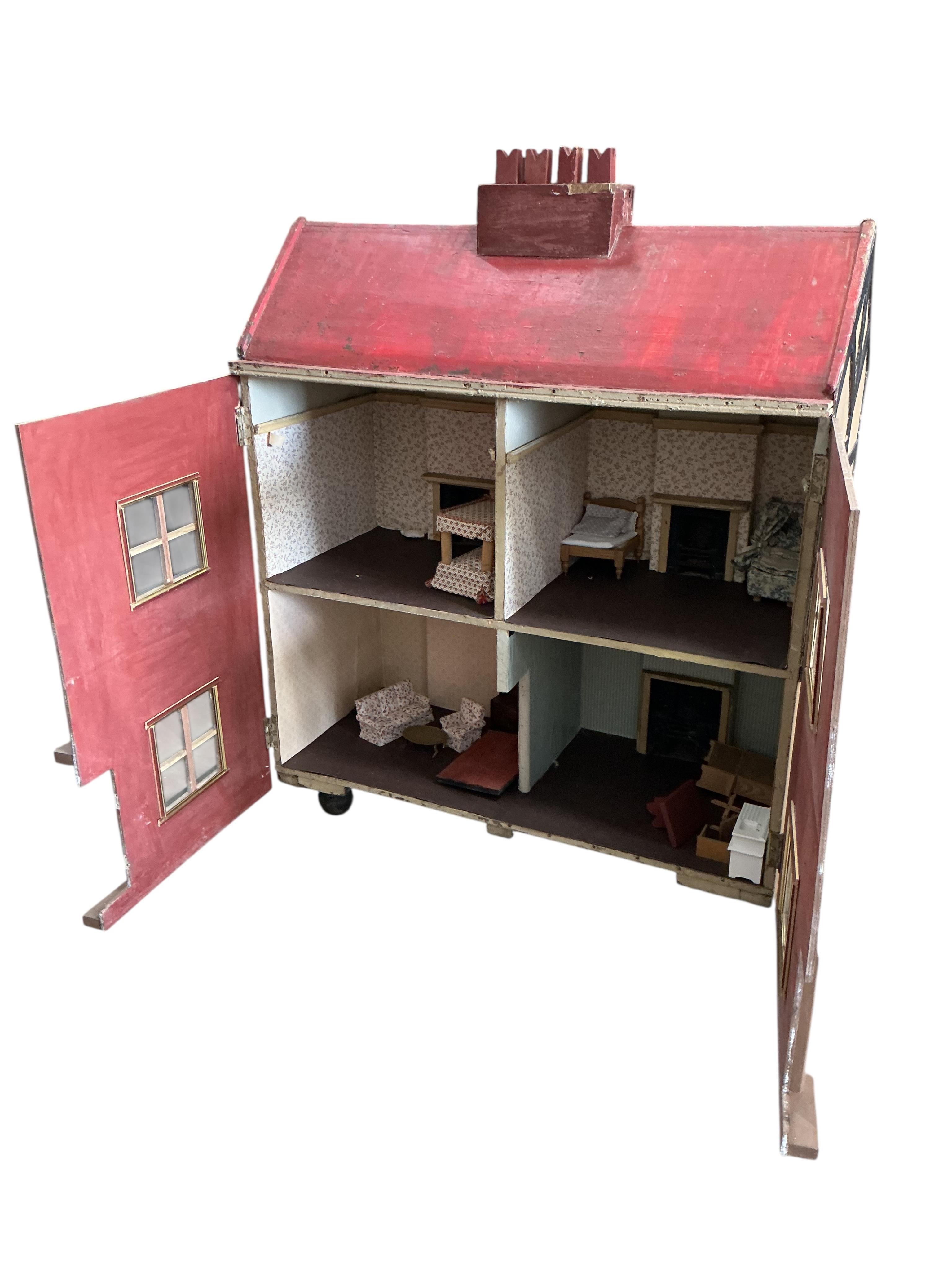 A mid century painted wood doll's house, width 96cm, depth 45cm, height 120cm